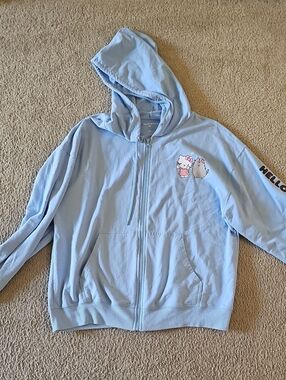Hello Kitty Pastel Blue Zip-Up Hoodie with Character Graphic